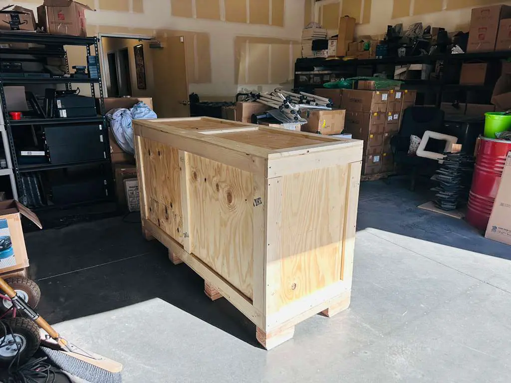 Custom wooden shipping crate in a warehouse setting, showcasing craftsmanship and suitability for Las Vegas businesses.