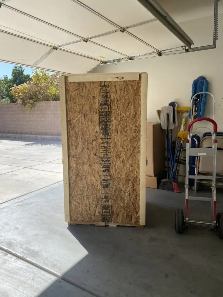 Custom wooden crate in Las Vegas garage, showcasing secure packaging for transport.