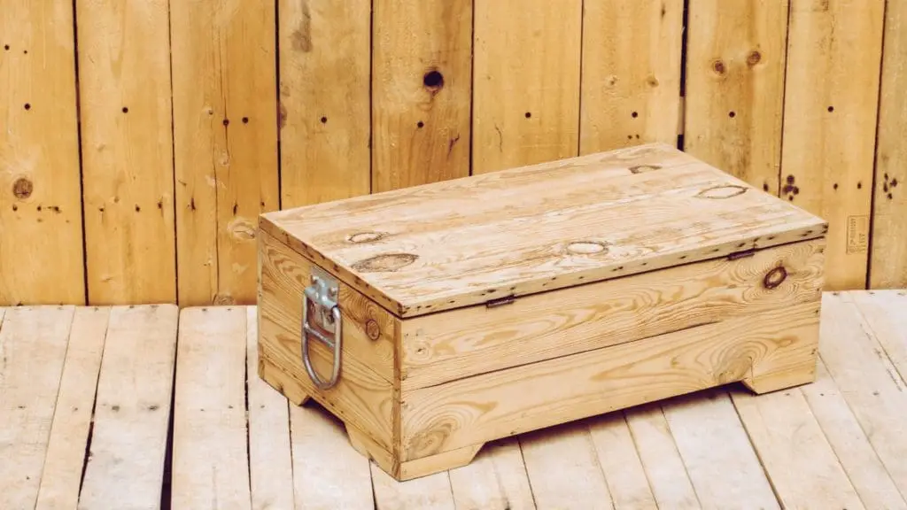 Custom wooden crate with metal latch and handle, ISPM-15 certification for secure shipping.