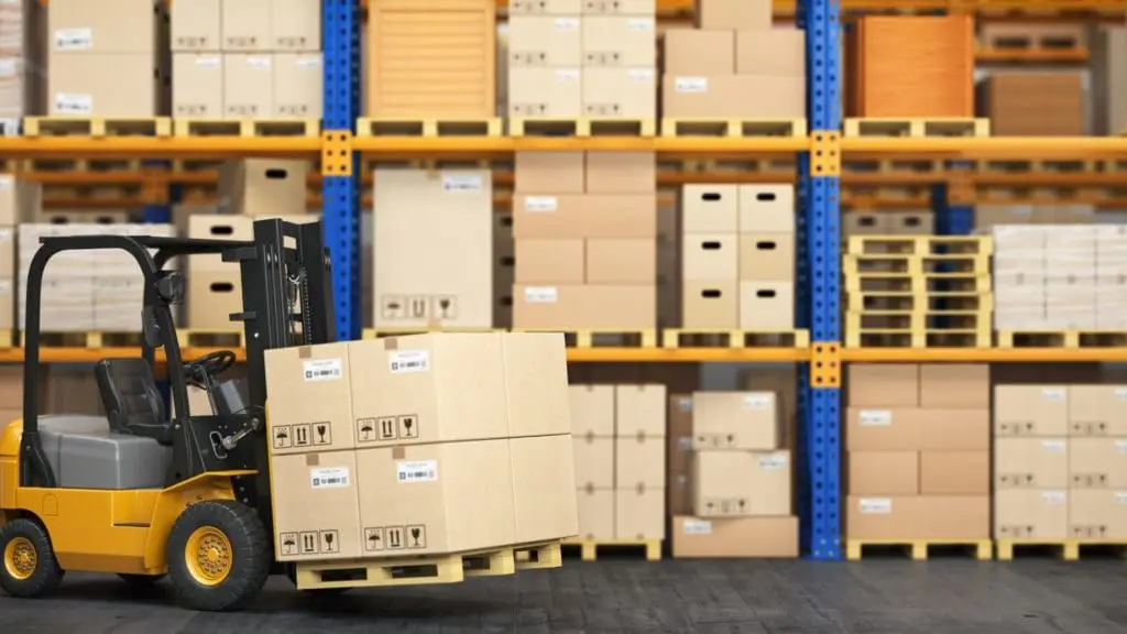 Custom wood crates and boxes in a warehouse, forklift transporting packaged goods.