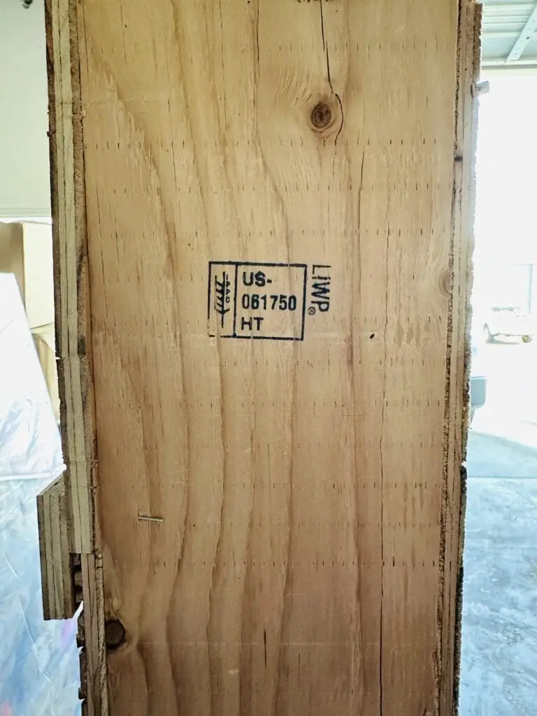 ISPM-15 certified wooden crate with heat treatment stamp and markings.